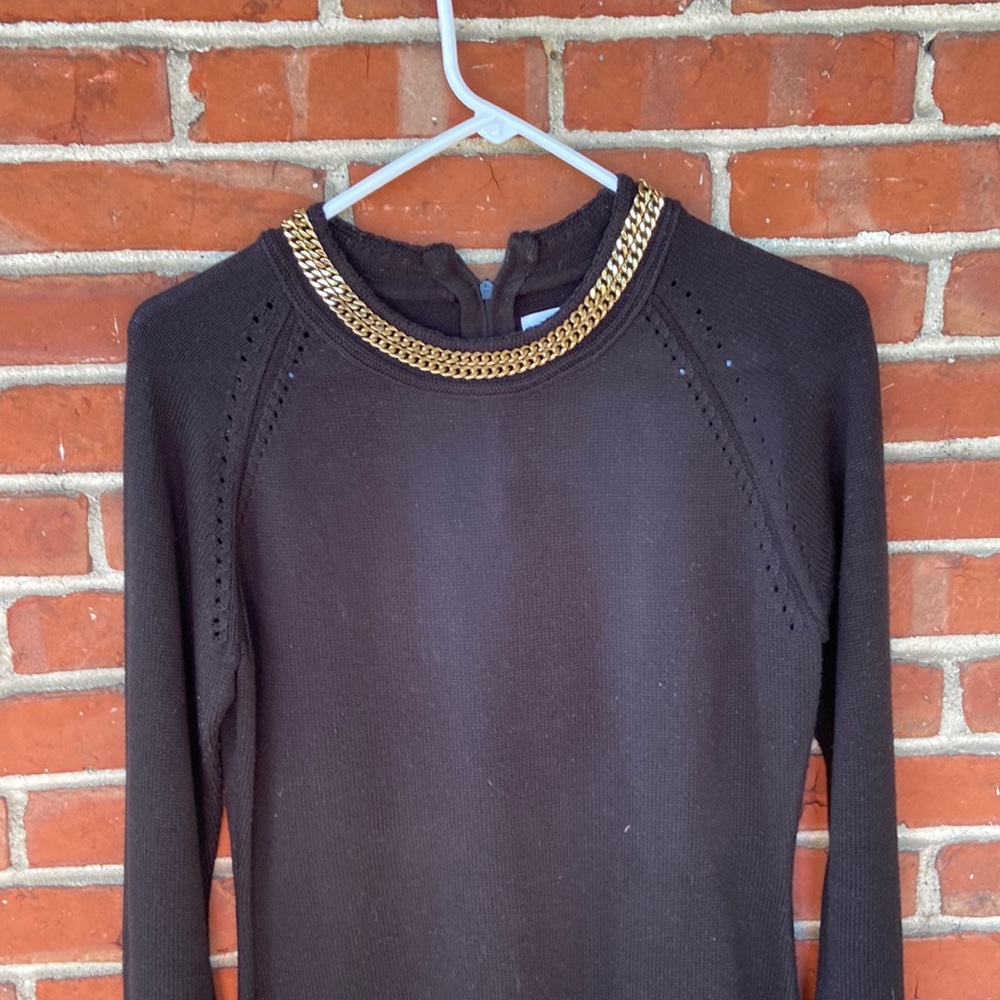 Black sweater dress with gold trim by Calvin Klein